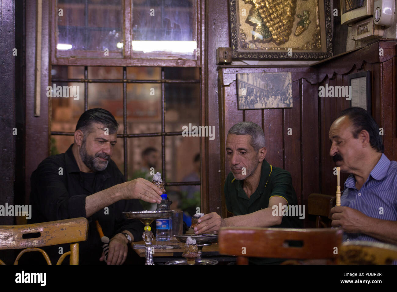 people enjoying time in old Damascus at al nawfra cafe Stock Photo