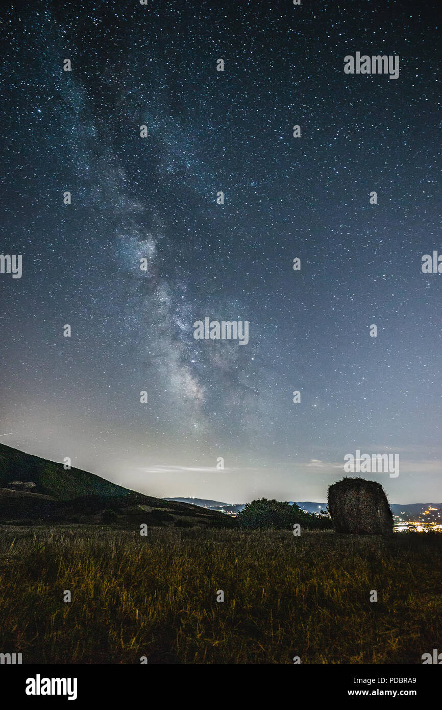 Beautiful view of starred night sky with milky way over a cultivated ...