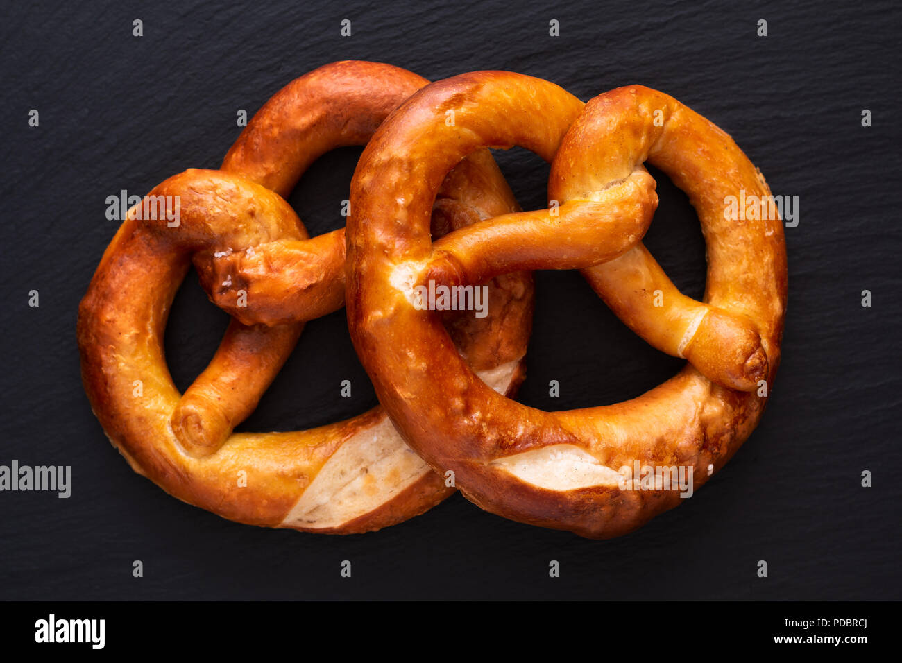 Homemade twisted knot Soft salt Pretzels on black slate board