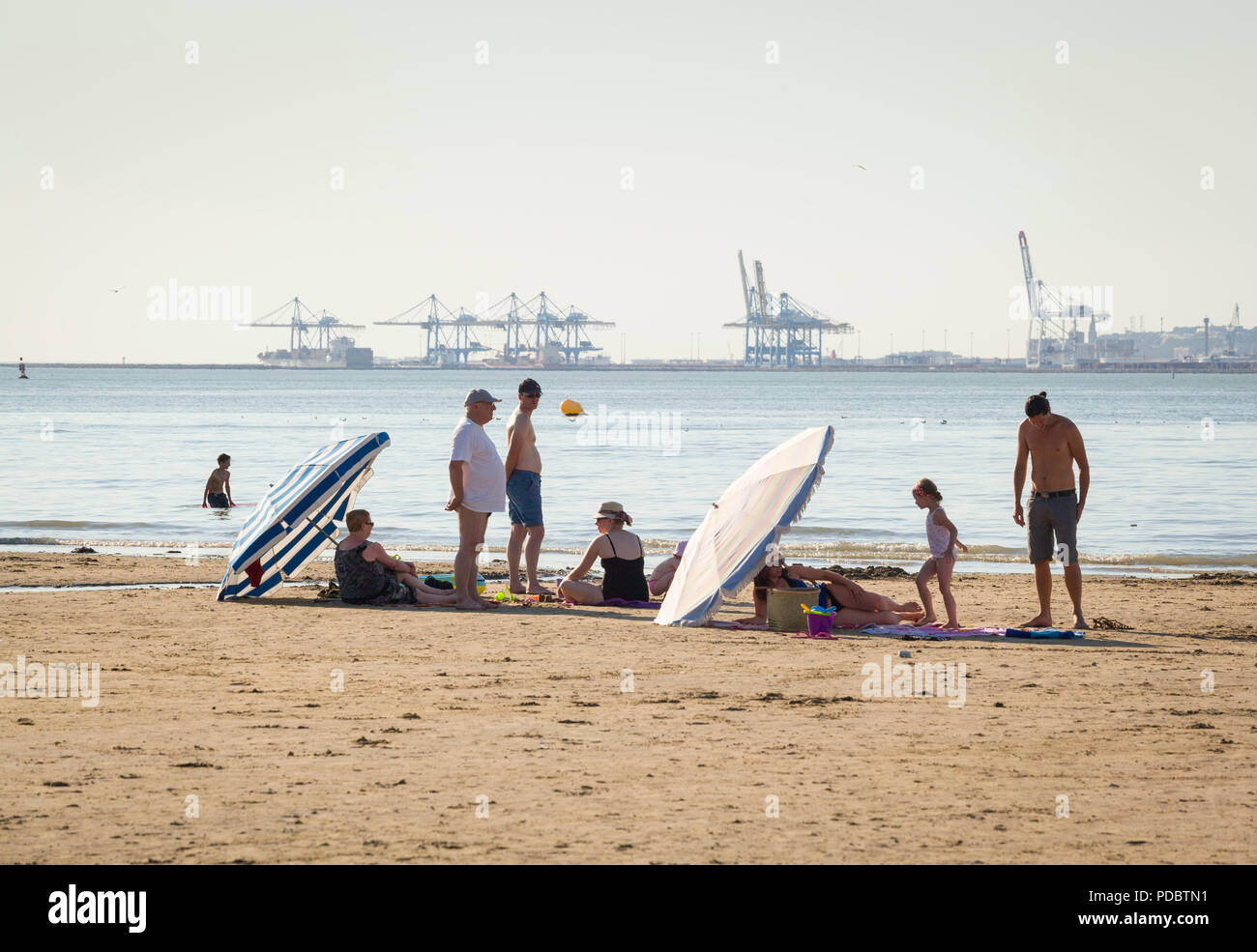 Holidaymakers Enjoy The Summer Sun On The Beach At Plage De