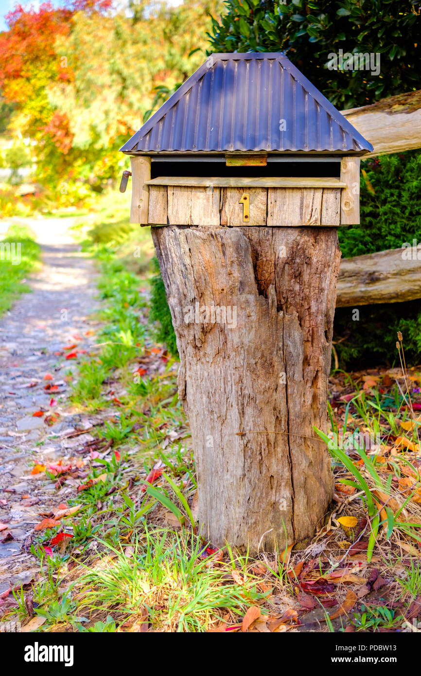 Australian home handmade wooden letterbox with number one installed on frontyard Stock Photo Alamy
