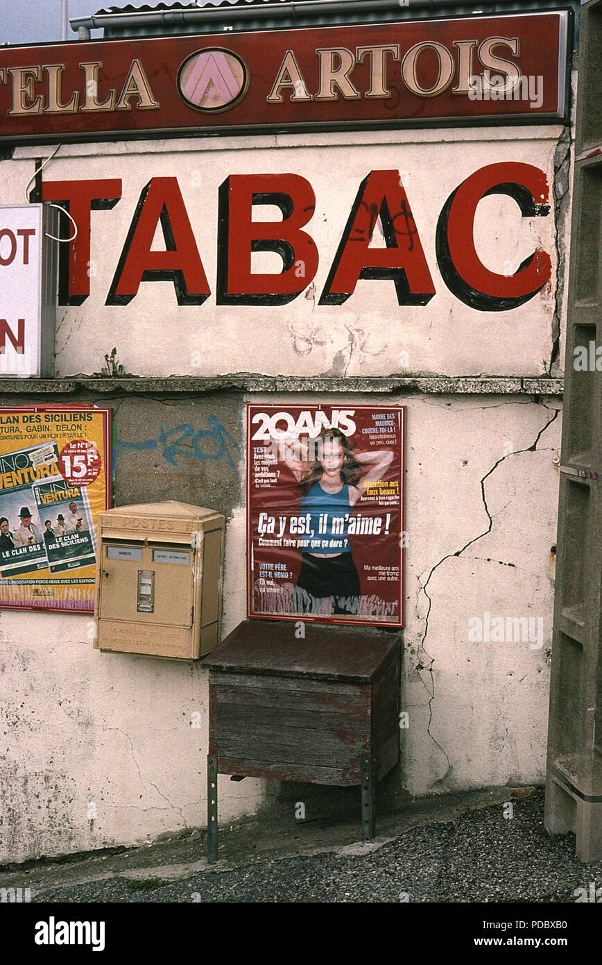 AJAXNETPHOTO. 1997. CHERBOURG, FRANCE. - TABAC - ADVERT ON WALL ADJACENT NEWSAGENT SHOP SELLING TOBACCO ON N2013 NEAR CHERBOURG - SITE BUSINESS STATUS SINCE CHANGED, SHOP AND ADVERTS NO LONGER EXIST. PHOTO:JONATHAN EASTLAND/AJAX REF:970880 Stock Photo