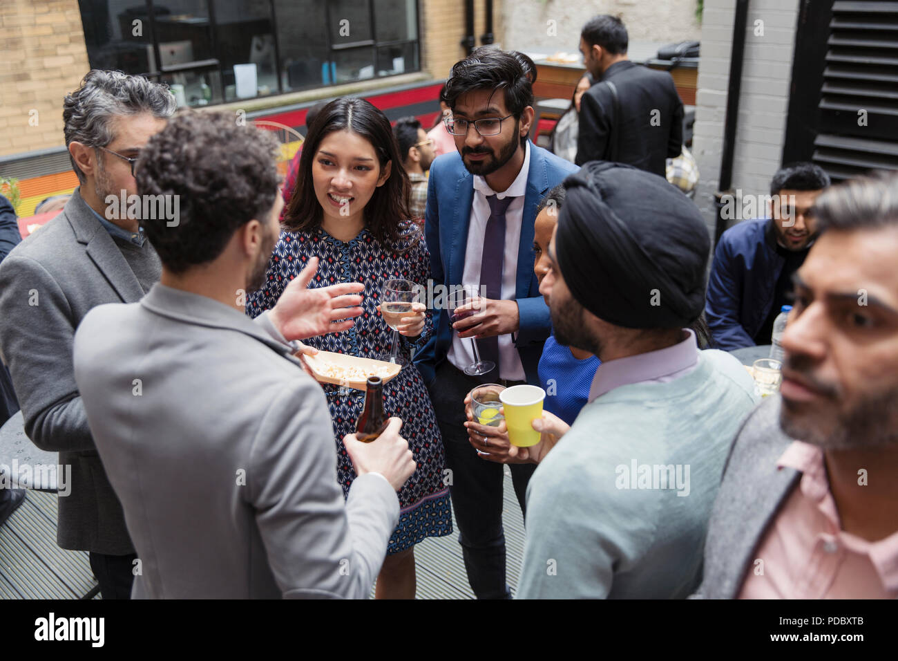 Friends drinking and socializing Stock Photo