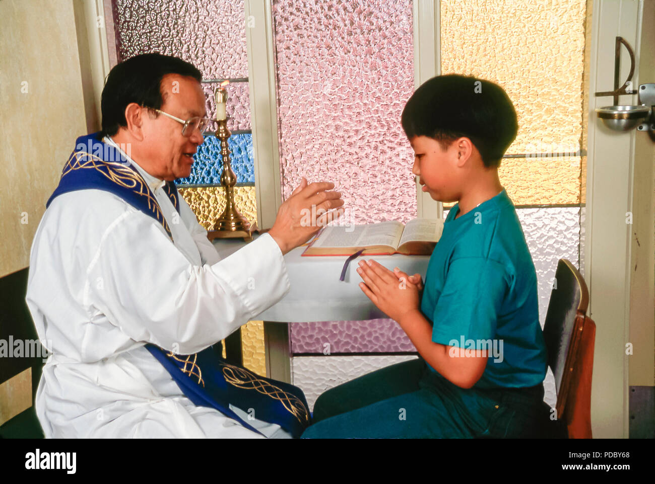 Catholic priest blessing child during reconciliation.  © Myrleen Pearson  ....Ferguson Cate Stock Photo