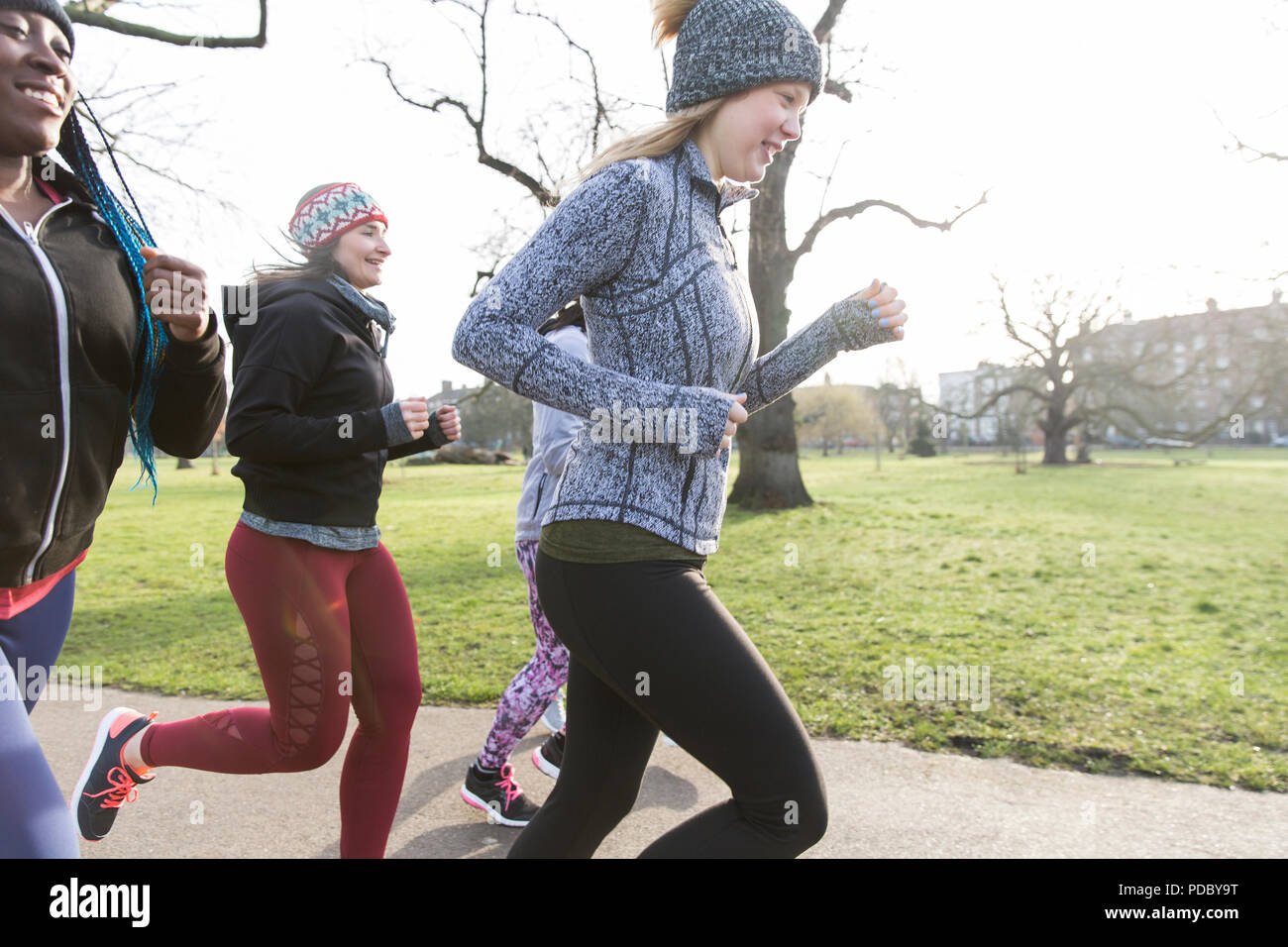 Female runners running in park Stock Photo