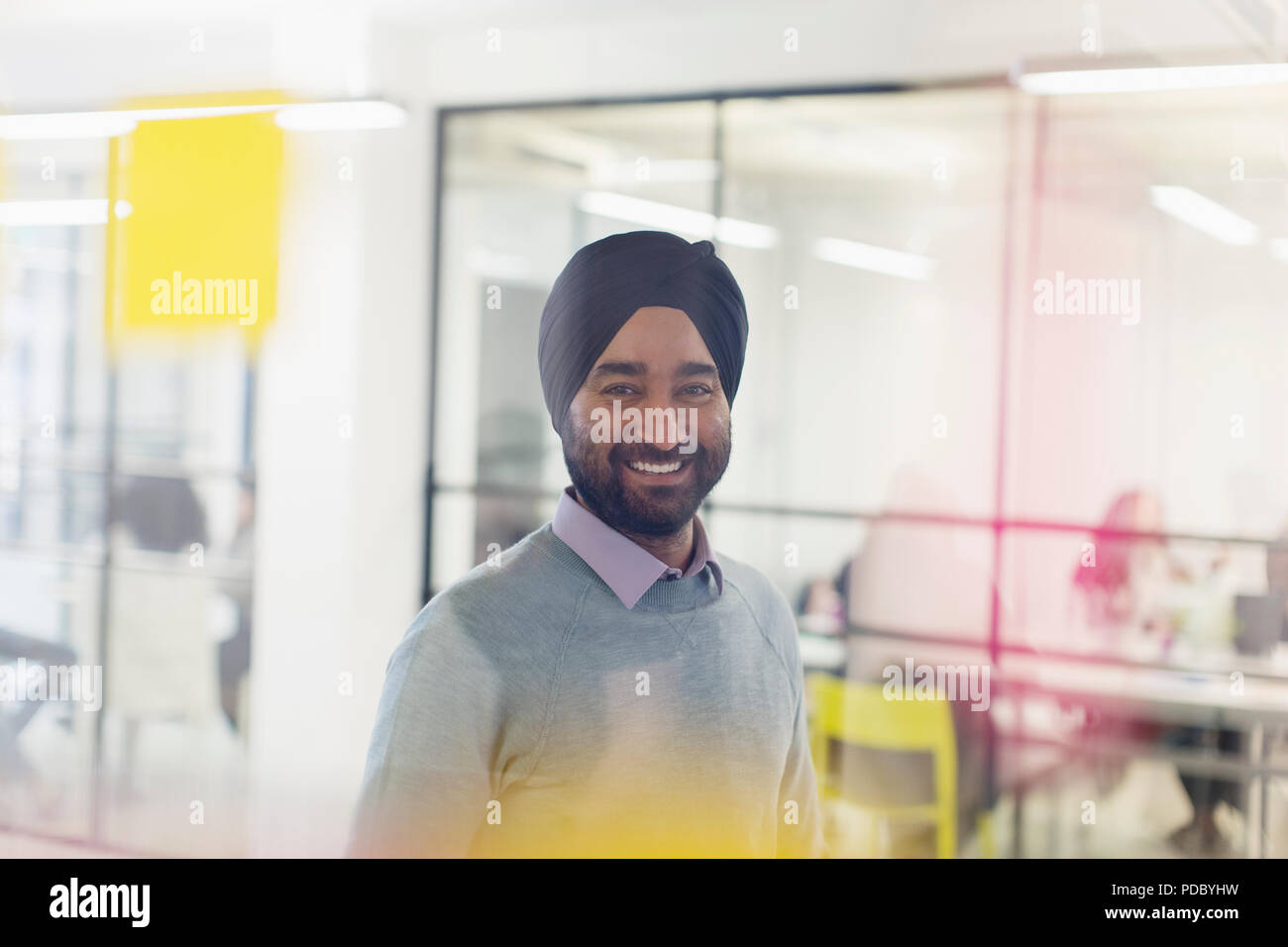Portrait smiling, confident businessman in turban Stock Photo