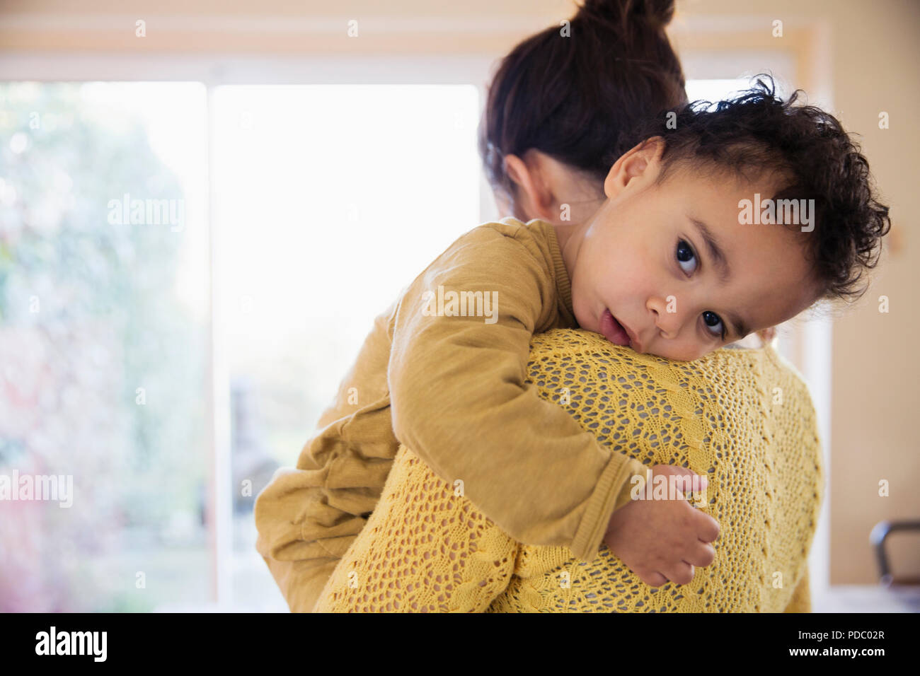 Affectionate mother holding baby son Stock Photo