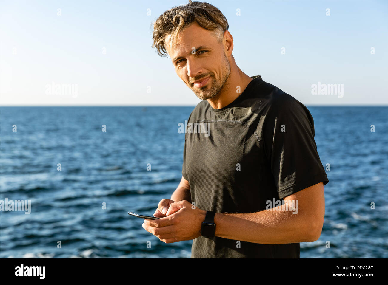 Happy adult man using hi-res stock photography and images - Alamy