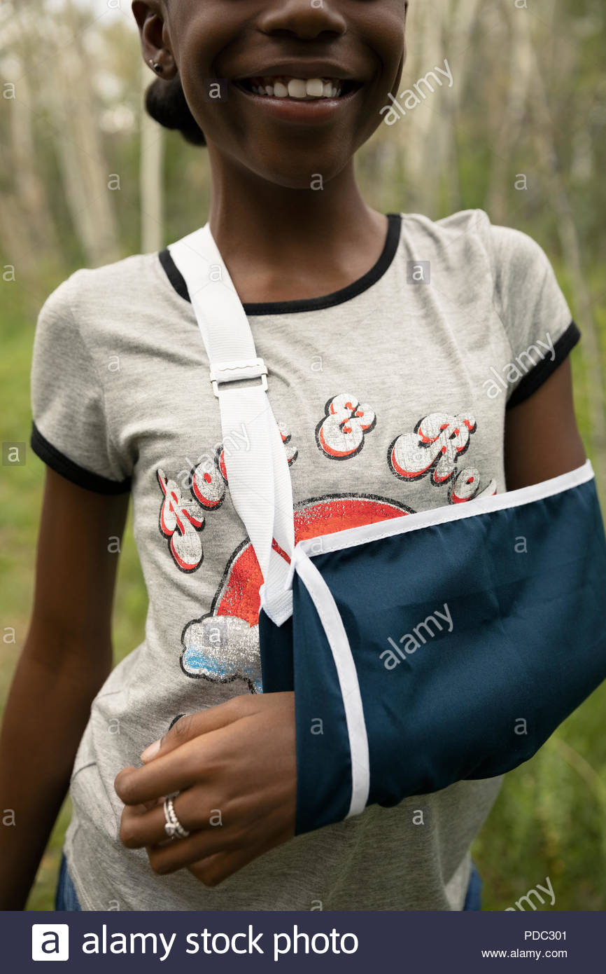 Close up tween girl with arm in sling Stock Photo