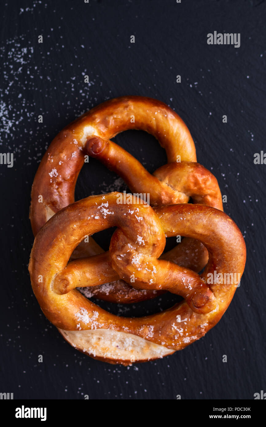 Homemade twisted knot Soft salt Pretzels on black slate board