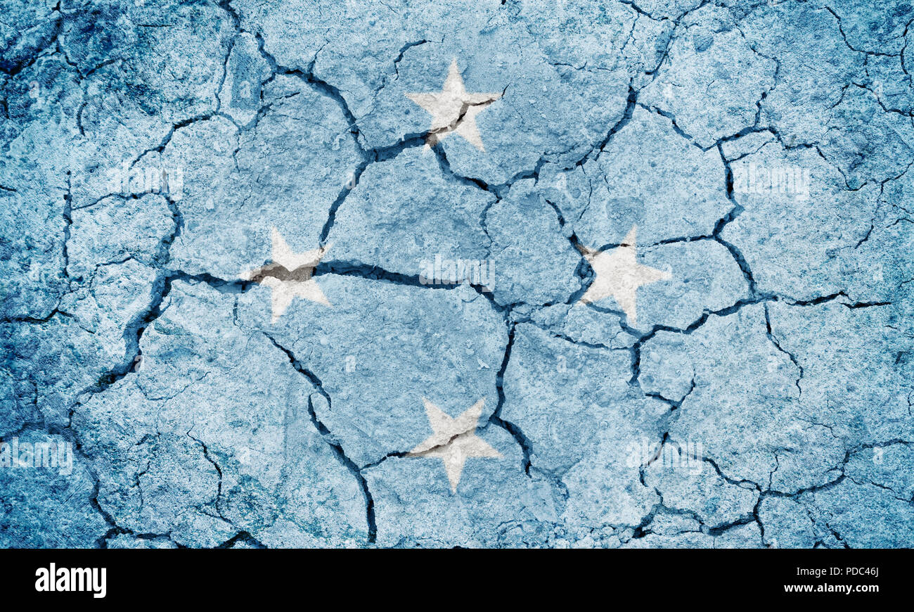 Federated States of Micronesia flag on dry earth ground texture background Stock Photo