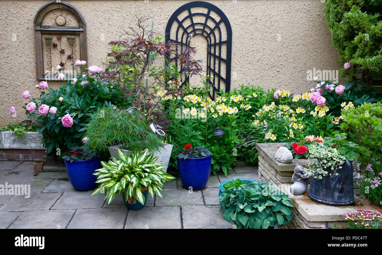 A beautiful display of patio pots and a colourful border Stock Photo