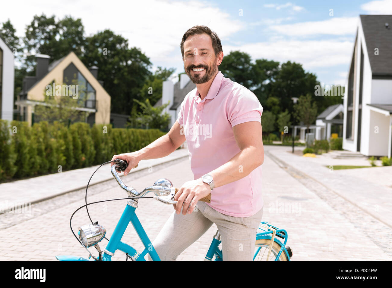 Positive nice man looking at you Stock Photo - Alamy