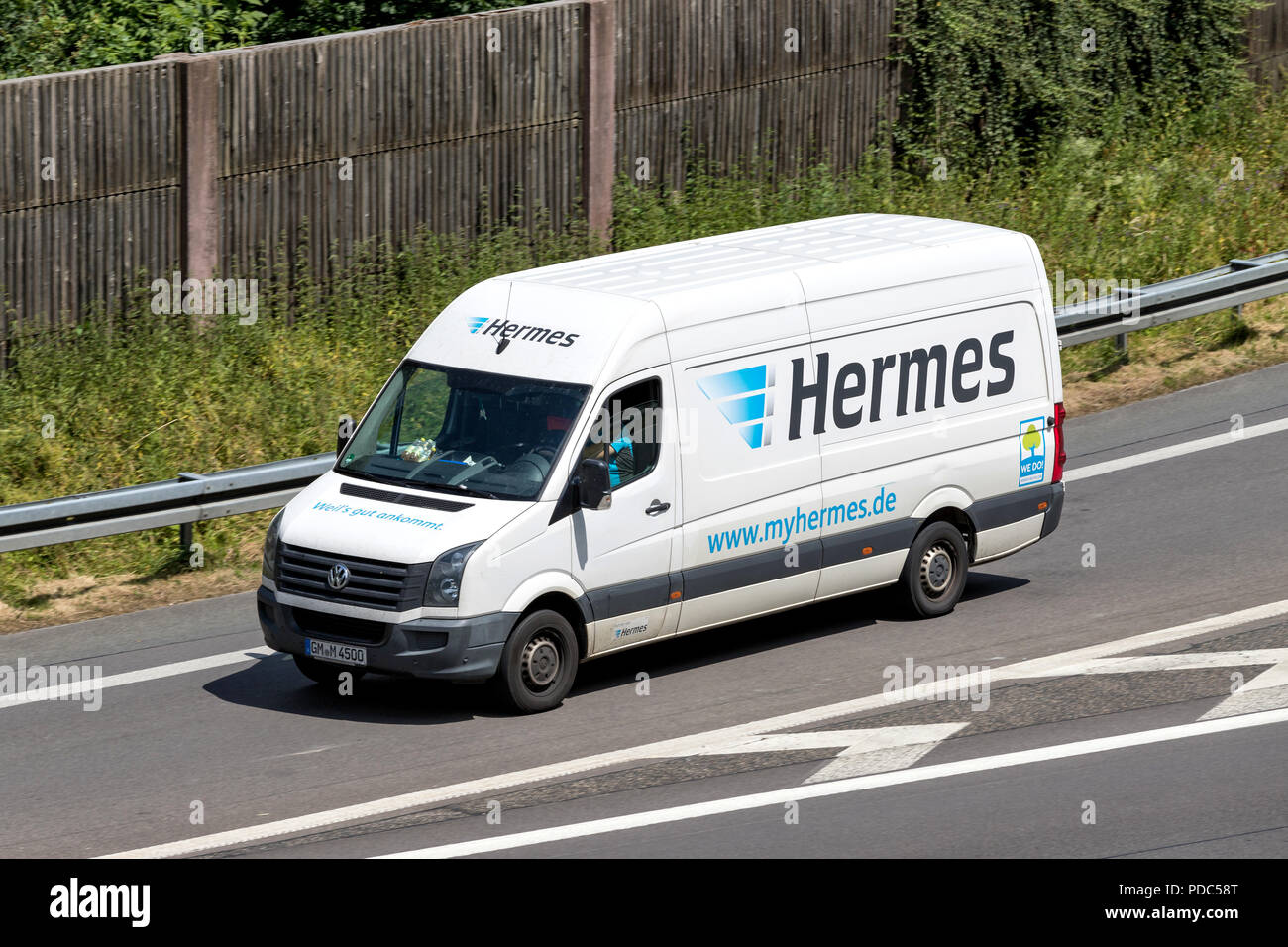 Hermes delivery van on motorway. Hermes is Germany’s largest post-independent provider of deliveries to private customers. Stock Photo