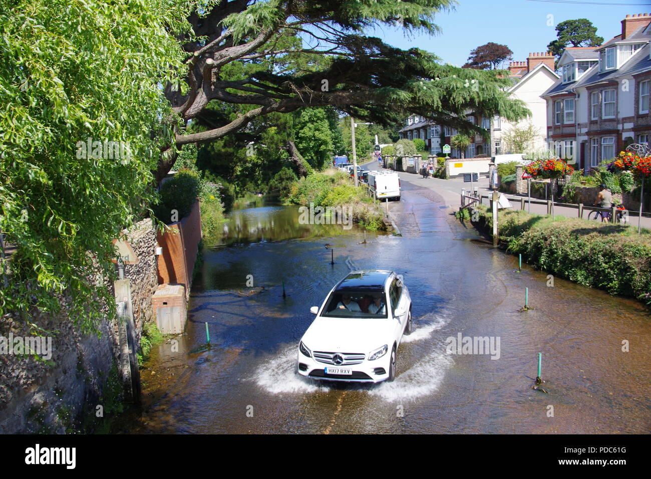 Car Fording the River Sid. East Devon, UK. August, 2018. Stock Photo