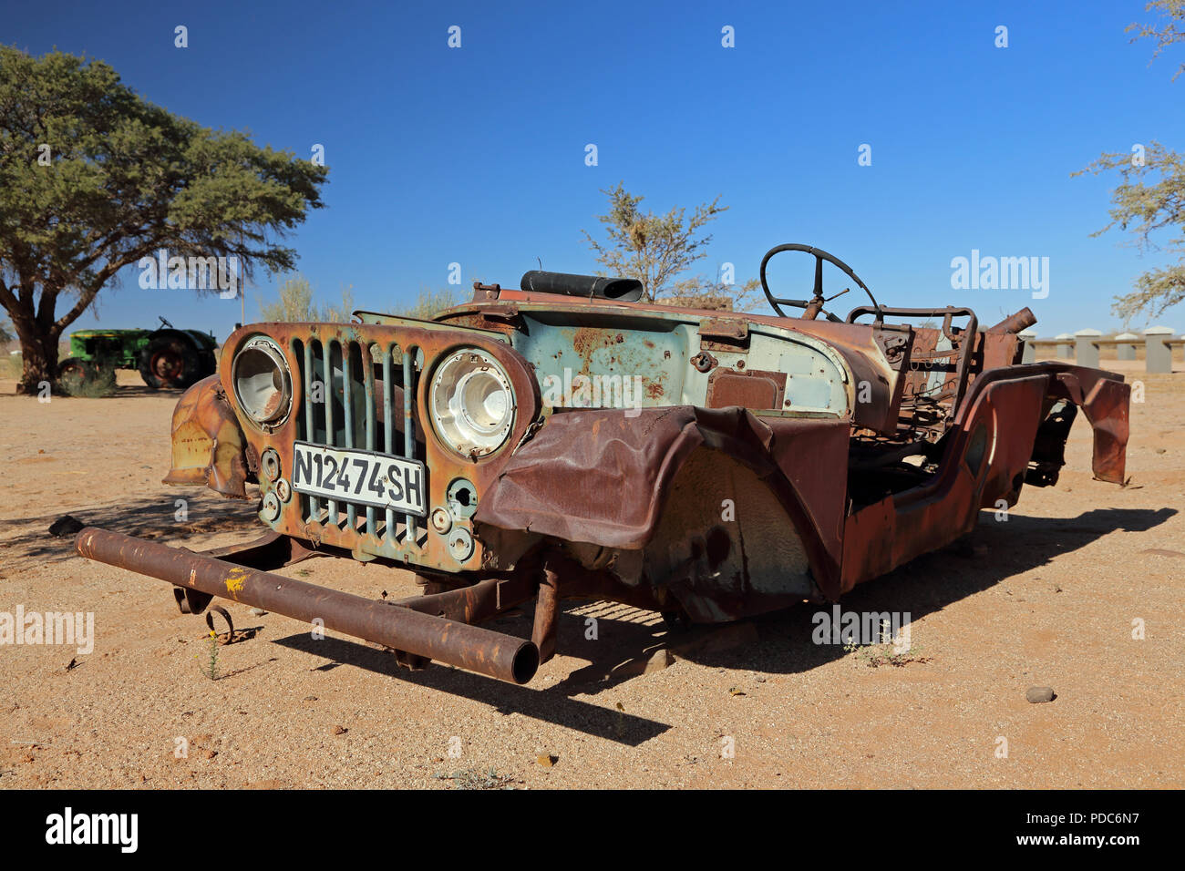 A wrecked vintage Jeep photographed at the Canyon Roadhouse, Namibia. Stock Photo