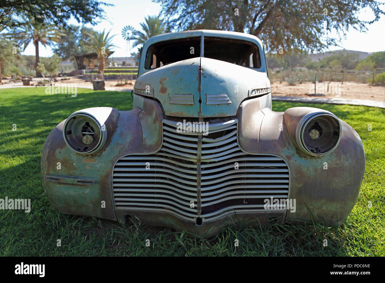 A wrecked vintage Chevrolet photographed at the Canyon Roadhouse, Namibia. Stock Photo