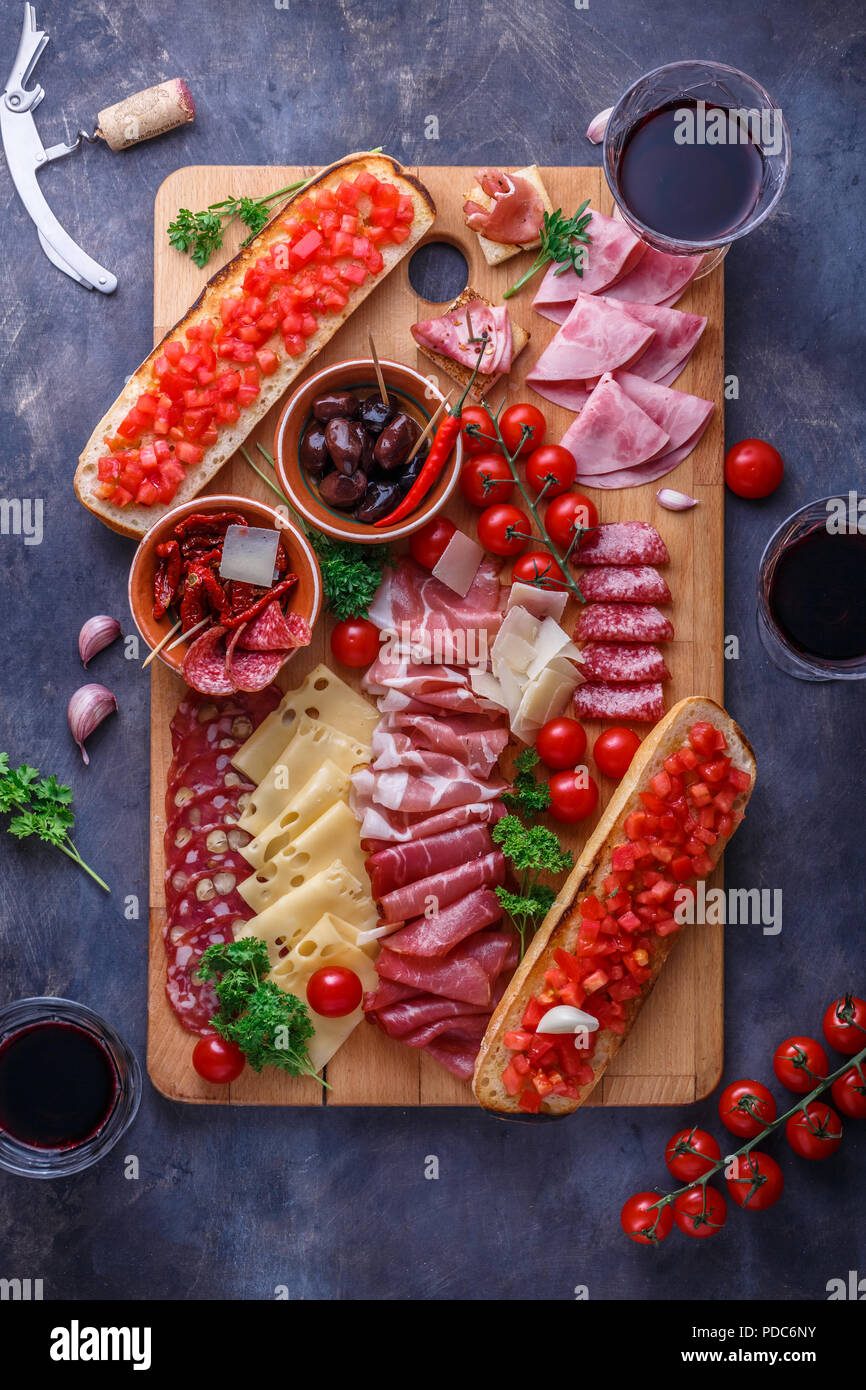 Board of cured meat, cheese and bread with wine Stock Photo Alamy