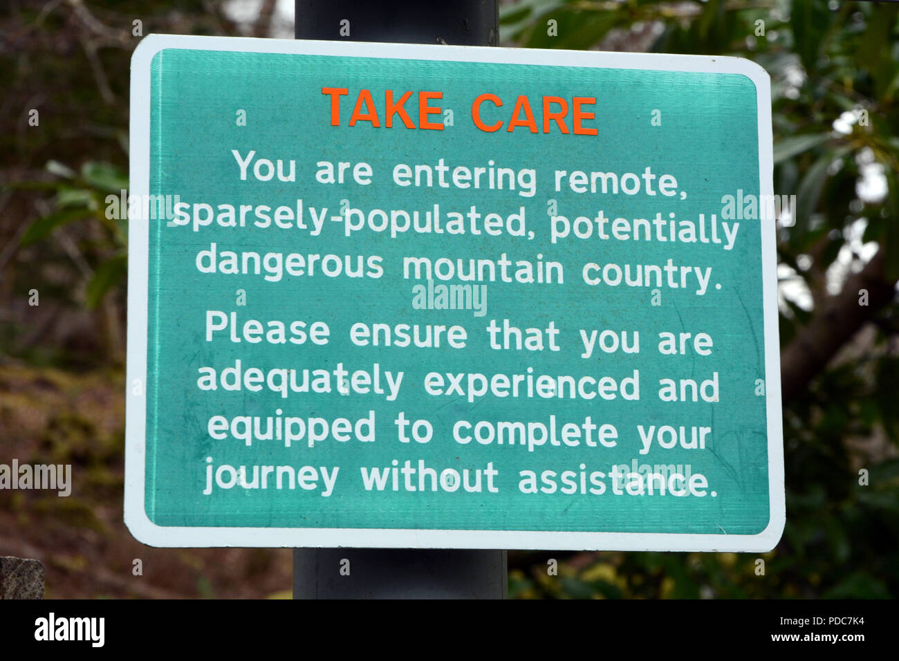 A sign warning travellers about the dangers of mountain country in Inverie, Knoydart Peninsula, Scottish Highlands, Scotland, United Kingdom. Stock Photo