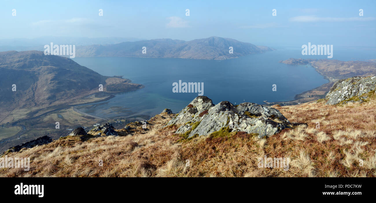 A mountain lookout on Sgurr Coire Choinnichean above the Atlantic ocean and the town of Inverie, Knoydart Peninsula, Scottish Highlands, Scotland, UK. Stock Photo