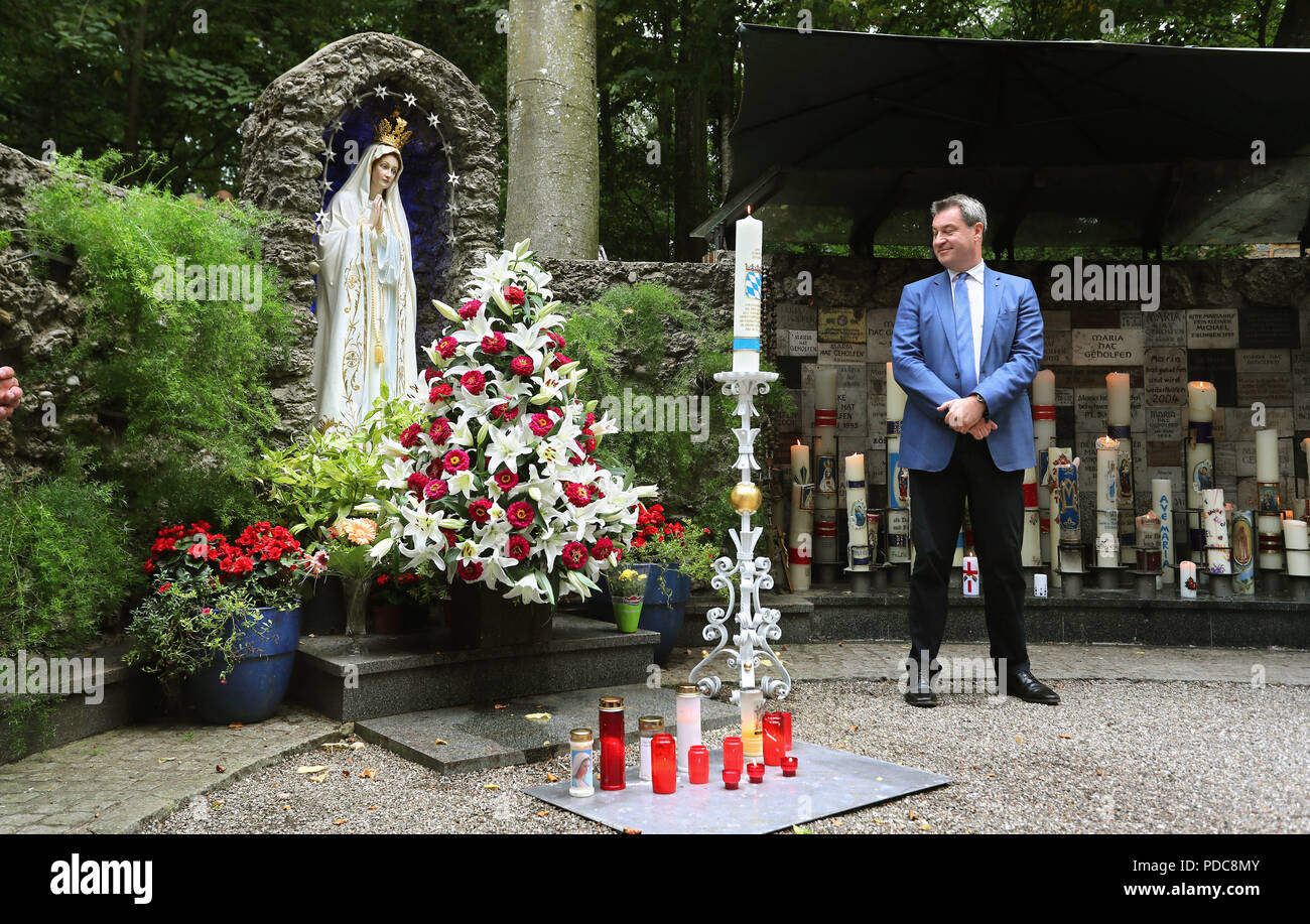 Ziemetshausen, Germany. 08th Aug, 2018. Markus Söder (CSU), Bavarian Prime Minister stands near the pilgrimage church Maria Vesperbild at the Mariengrotte next to a candle donated by him. In the run-up to the last meeting of the Bavarian cabinet before the summer break in nearby Ursberg, Söder visited the place of pilgrimage. Credit: Karl-Josef Hildenbrand/dpa/Alamy Live News Stock Photo