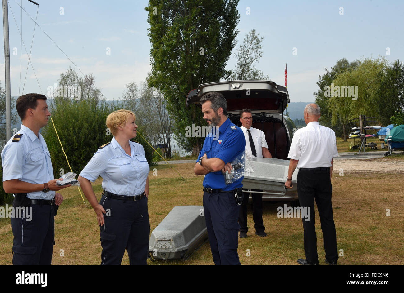 Radolfzell, Germany. 08th Aug, 2018. The actors Simon Werdeles (in the role of Pirmin Spitznagel, L-R), Floriane Daniel (in the role of Nele Fehrenbach) and Martin Rapold (in the role of Captain Adrian Aubry), are shooting a scene for the series 'WaPo Bodensee' (lit. Water Police Lake Constance), episode 'Seidenstrasse' (lit. silk street). The series is to be broadcasted on the German TV channel ARD at the beginning of 2019 on Tuesdays at 6.50 p.m. Credit: Ursula Düren/dpa/Alamy Live News Stock Photo