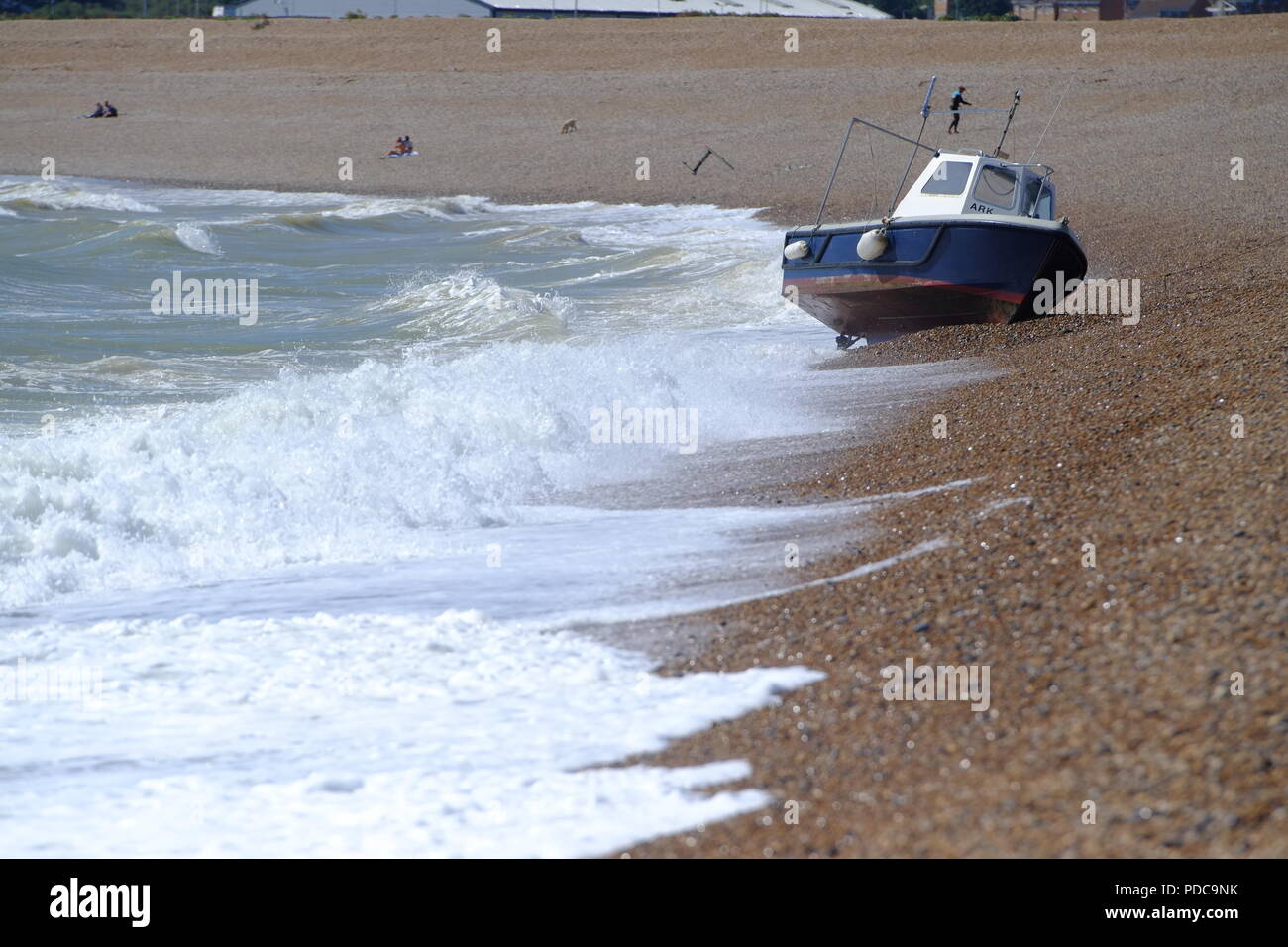 Seaford, East Sussex, UK. fishing boat washes up on Seaford beach after strong winds. Stock Photo