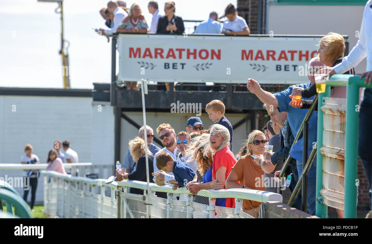 Brighton UK 8th August 2018 -  Racegoers at the Brighton Races Marathonbet Festival of Racing Marstons Opening Day  Credit: Simon Dack/Alamy Live News Stock Photo