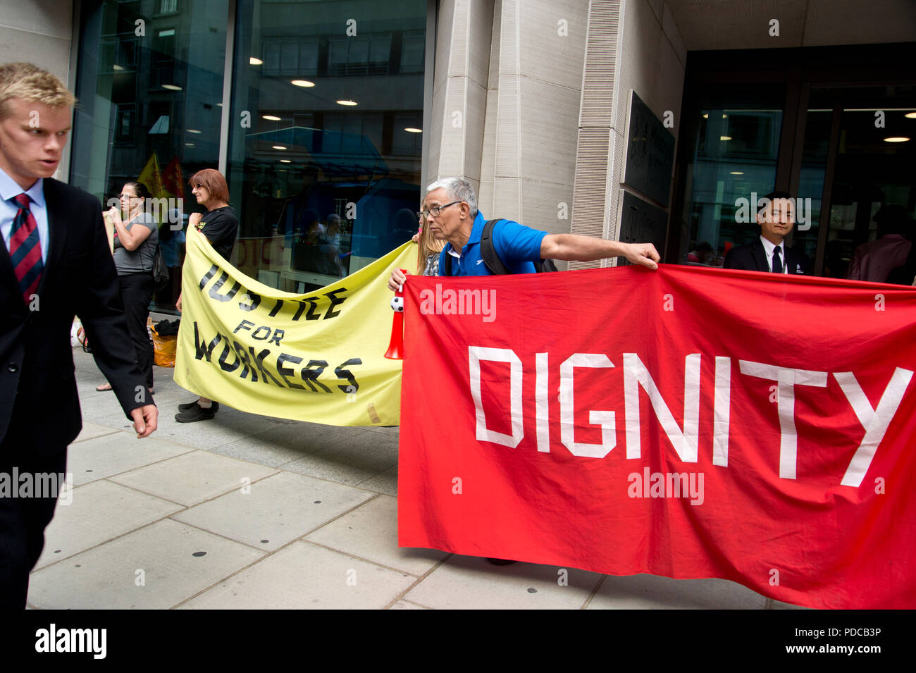 London, UK. 8th August, 2018. Ministry of Justice, Petty France, London. Cleaners from the United Voices of the World Union strike for three days demanding they be paid the London Living Wage of £10.20 an hour instead of the minimum wage of £7.83 that they currently get. Credit: Jenny Matthews/Alamy Live News Stock Photo
