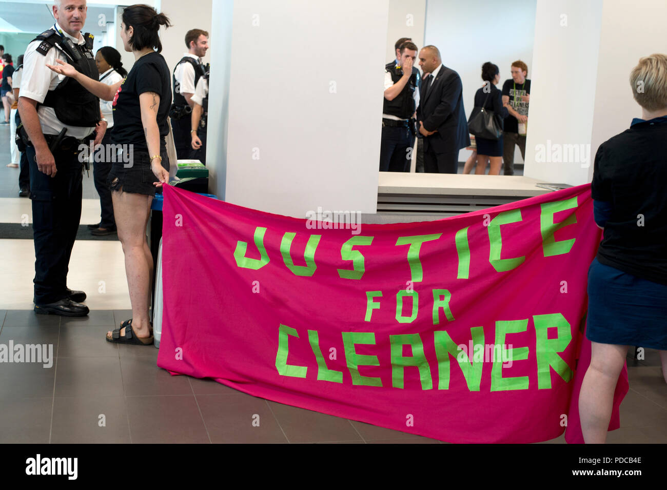 London, UK. 8th August, 2018. Ministry of Justice, Petty France, London. Cleaners from the United Voices of the World Union strike for three days demanding they be paid the London Living Wage of £10.20 an hour instead of the minimum wage of £7.83 that they currently get. Cleaners and their supporters occupied the Ministry for over an hour until a meeting was arranged with a Minister's representative, a meeting they have been requesting since December 2017. Credit: Jenny Matthews/Alamy Live News Stock Photo