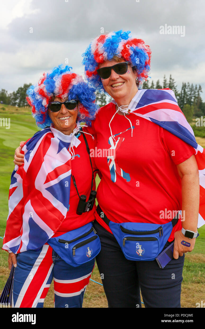 Gleneagles, Scotland, UK. 9th August, 2018. Two friends; ANN MURPHY (left) and HANNAH SYKES (right) travelled from Liverpool to support their favourite golfer; LEE SLATER who partnering Callum SHINKWIN is competing in the four ball match play representing; Great Britain 1. Both women have on red jerseys because they are Liverpool FC supporters. Credit: Findlay/Alamy Live News Stock Photo