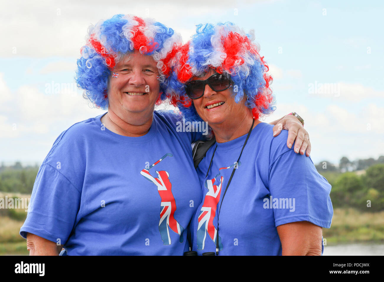 Gleneagles, Scotland, UK. 9th August, 2018. Two friends Janet O'Connor (left) and Sue Cooke (right) travelled from Liverpool to watch and support their favourite golfer Lee Slatery who was playing with Callum Shnkwin in Great Britain 1 at the European Championships 4 ball match play. Both women are wearing blue jerseys because they are Everton supporters Credit: Findlay/Alamy Live News Stock Photo
