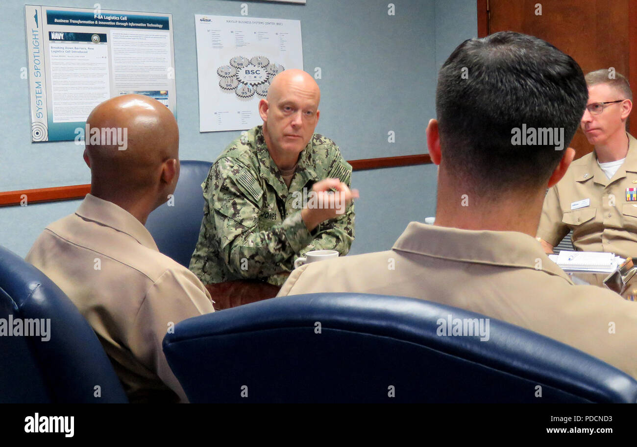 180803-N-PX557-021  MECHANICSBURG, Pa.  (Aug. 3, 2018)  Rear Adm. Kevin M. Jones, commander, Defense Logistics Agency Distribution, speaks to Naval Supply Systems Command (NAVSUP) Business Systems Center (BSC) officers during a mentoring session at NAVSUP BSC in Mechanicsburg, Pa., Aug. 3. The session was part of a series, “Mentoring without End,” which brings together senior and junior Supply Corps officers in the Mechanicsburg area to share experiences, network, and collaborate.   (U.S. Navy photo by James E. Foehl/Released) Stock Photo