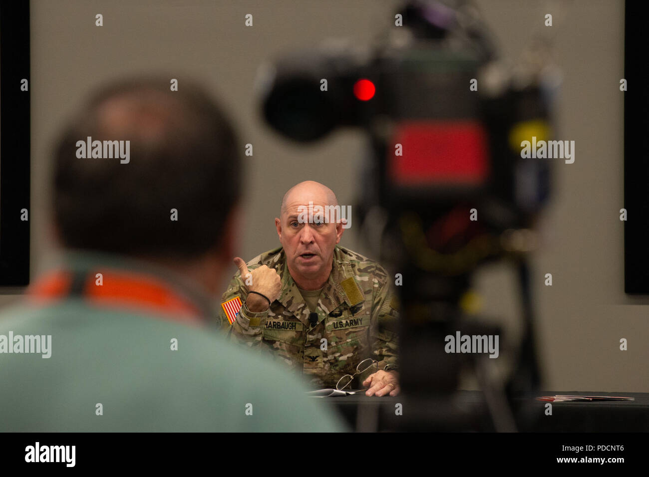 Army Col. Cary Harbaugh, U.S. Special Operations Command Warrior Games 2019 director, briefs local media on the 2019 DoD Warrior Games in Tampa, Fla., Aug. 6, 2018. The games, scheduled from June 21-30, introduce wounded, ill and injured service members and veterans to paralympic-style sports. More than 300 athletes will compete in 14 events located in downtown Tampa and surrounding areas. (Photo by U.S. Air Force Master Sgt. Barry Loo) Stock Photo
