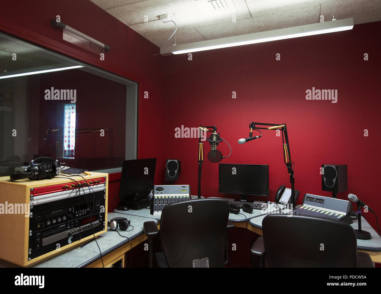Music recording equipment in sound booth Stock Photo
