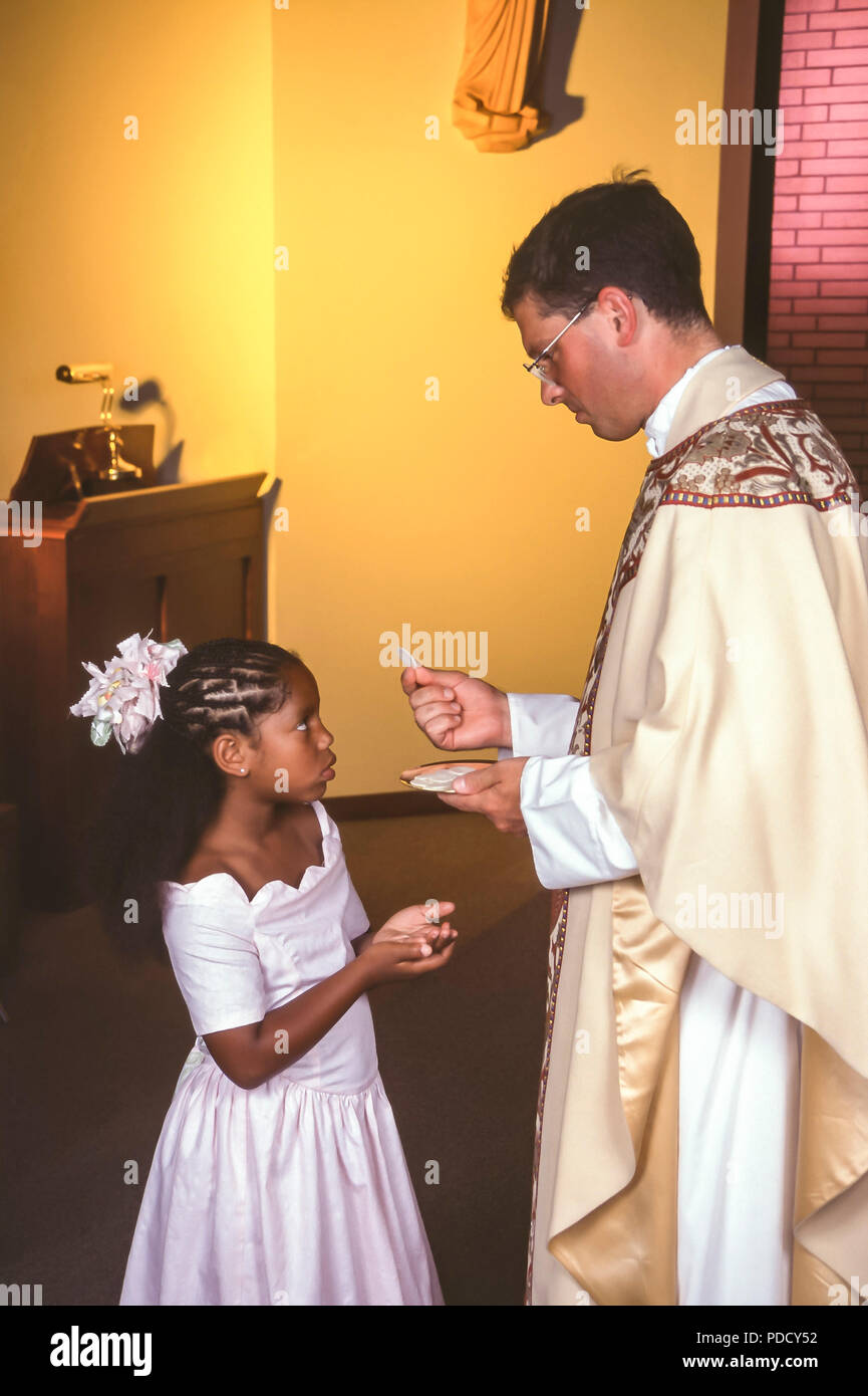 Child receives Holy Communion MR.  © Myrleen Pearson  .....Ferguson Cate Stock Photo