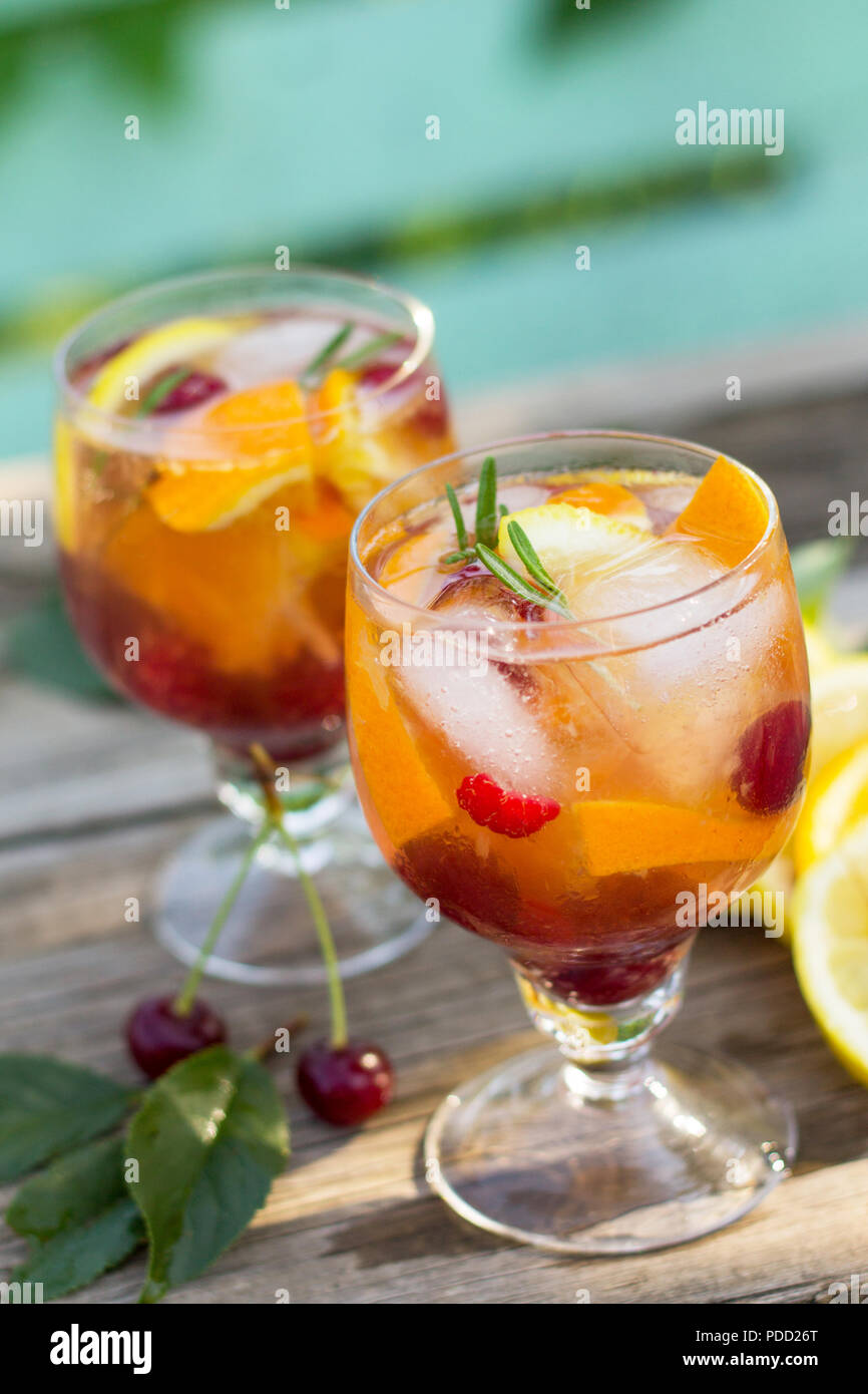 Homemade refreshing wine sangria or punch with fruits in glasses