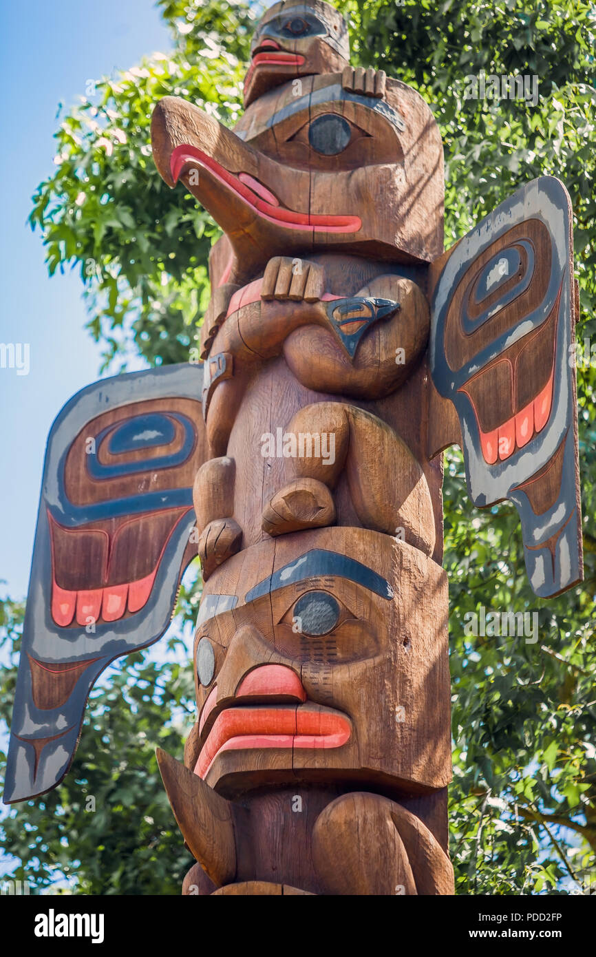 Cedar and Salmon totem pole at the Old Fishing Hole Kent Seattle Washington USA on 05.07.2018 Stock Photo