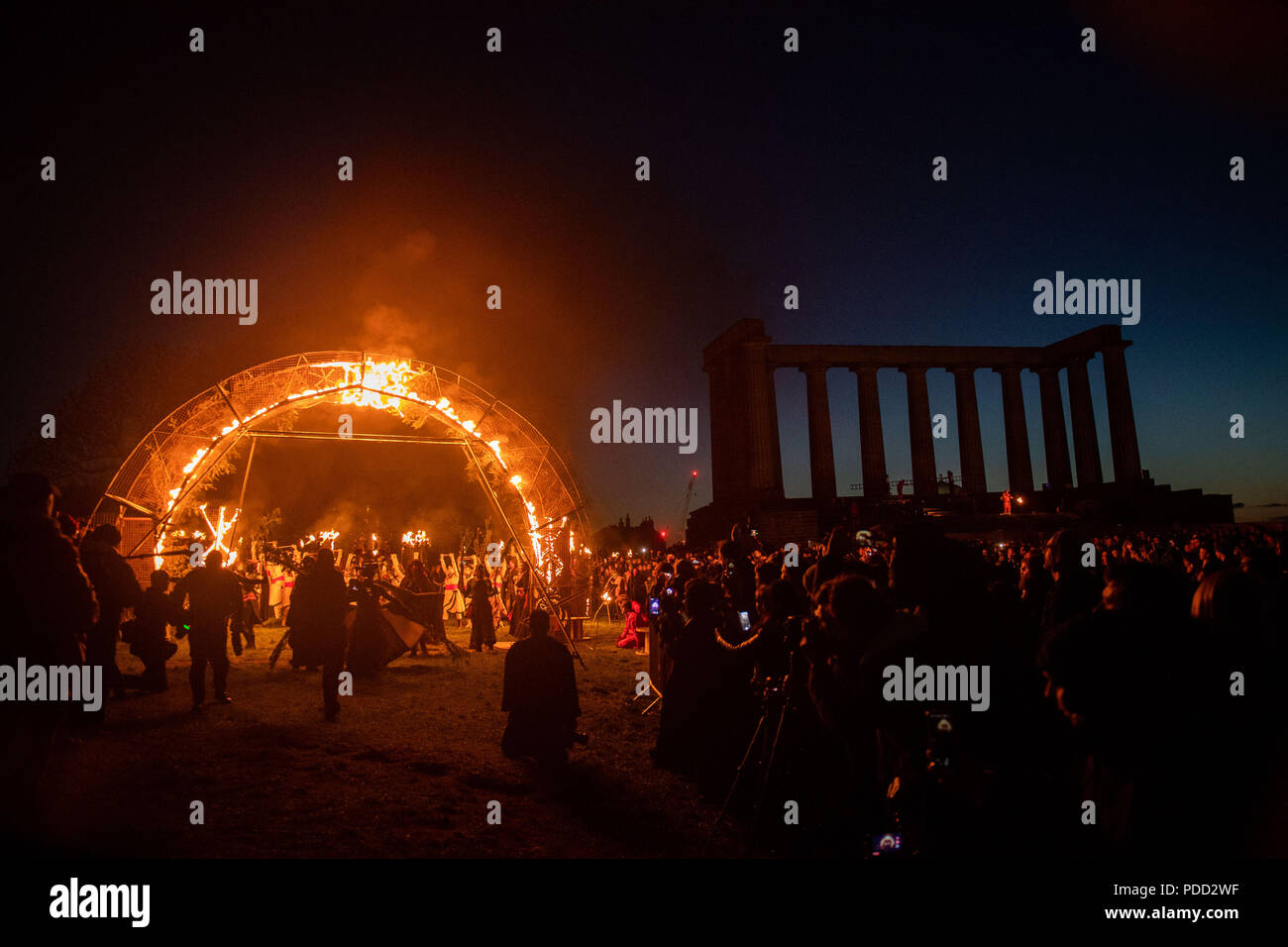 Beltane Fire Festival ushers in summer on Monday 30th April with a spectacular display of fire, immersive theatre, drumming, bodypaint, and elaborate Stock Photo
