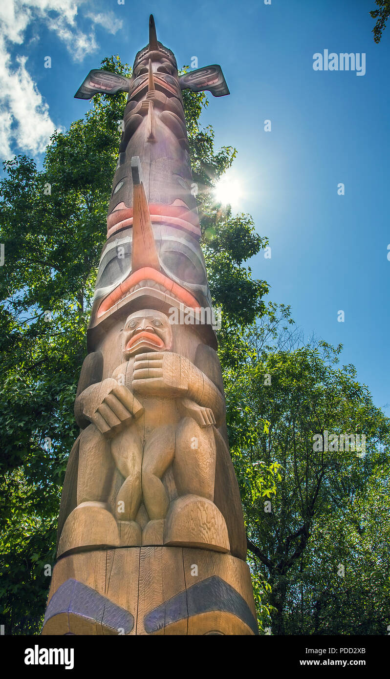 Cedar and Salmon totem pole at the Old Fishing Hole Kent Seattle Washington USA on 05.07.2018 Stock Photo