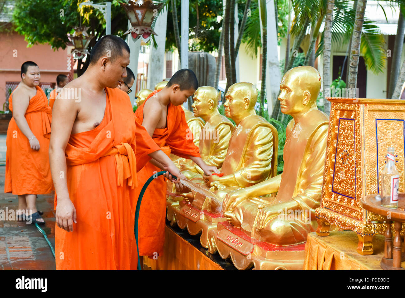 Buddhist monks washing statues at at  Wat Phra Singh, Buddhist temple, Chiang Mai , ThailandCleaning Stock Photo