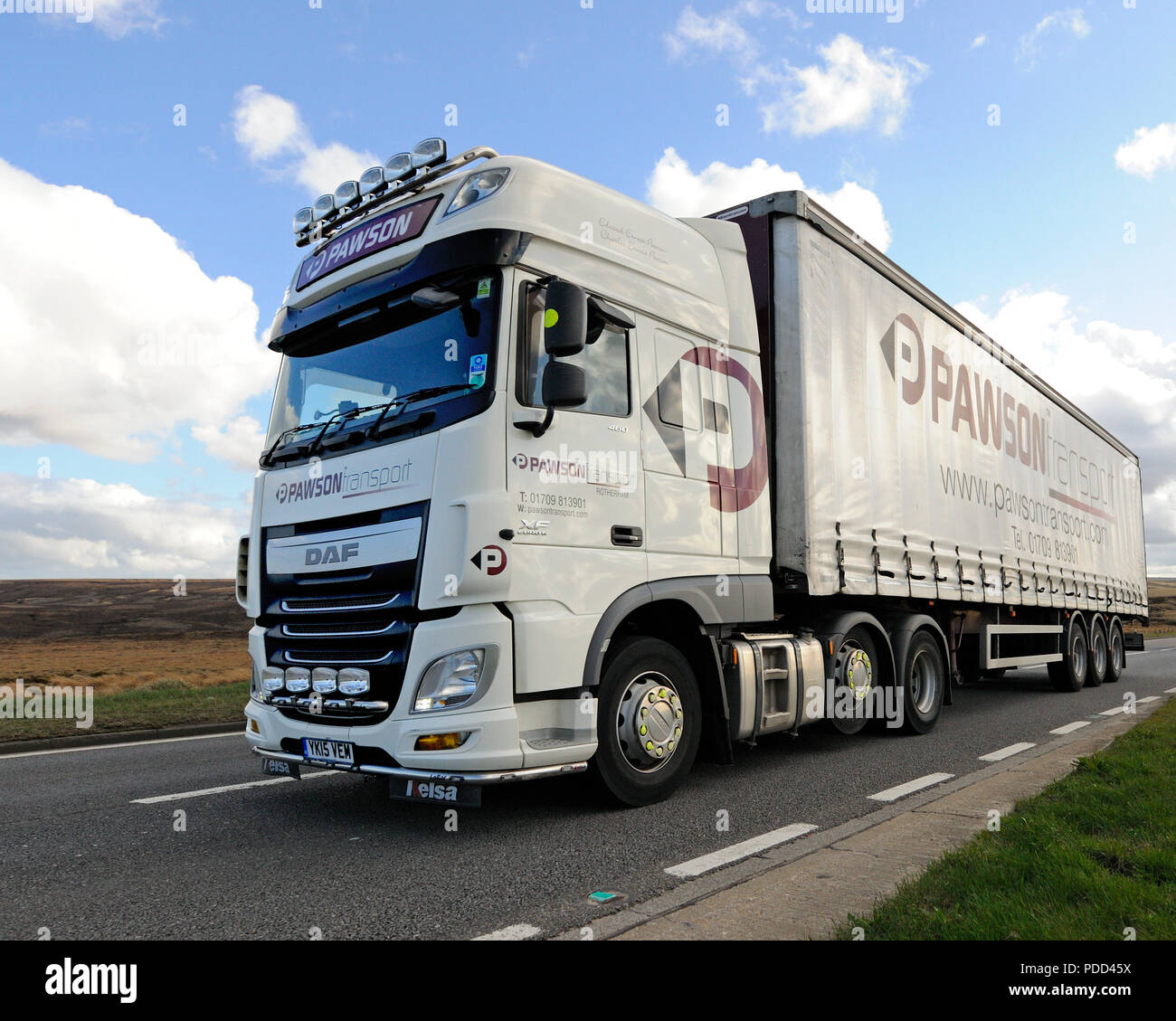 Pawson's DAF truck towing curtainsider trailer driving on the A628 Woodhead Pass in Yorkshire, UK Stock Photo