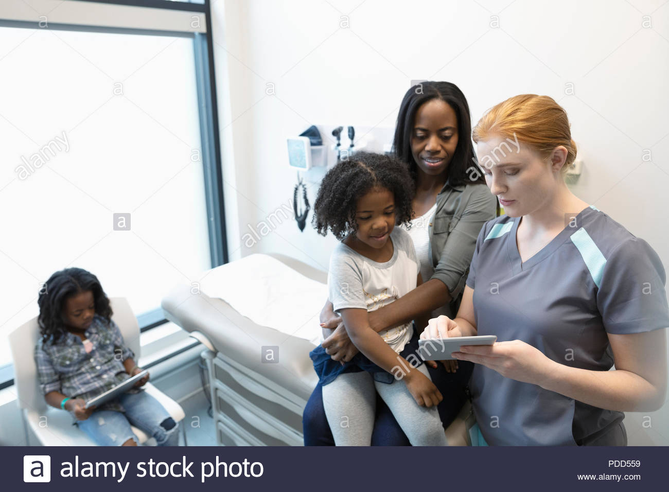 Nurse standing digital talking hi-res stock photography and images - Alamy