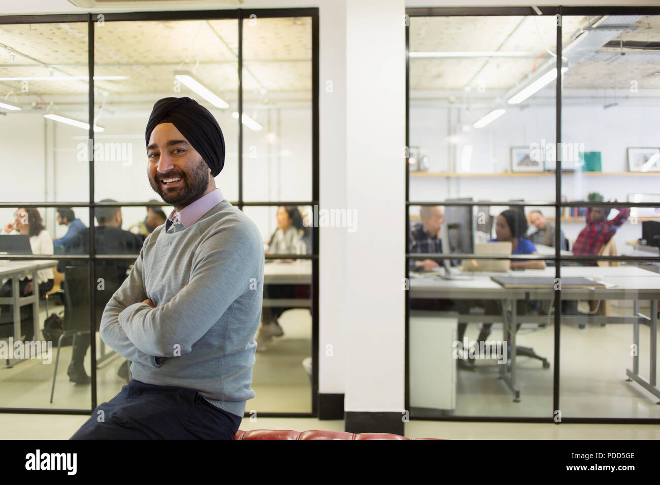 Portrait confident businessman in turban in office Stock Photo