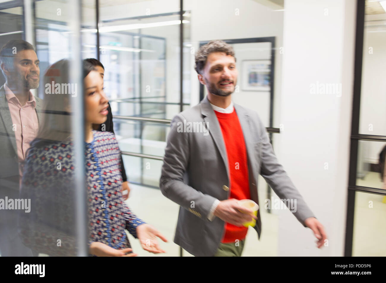 Business people walking in office Stock Photo