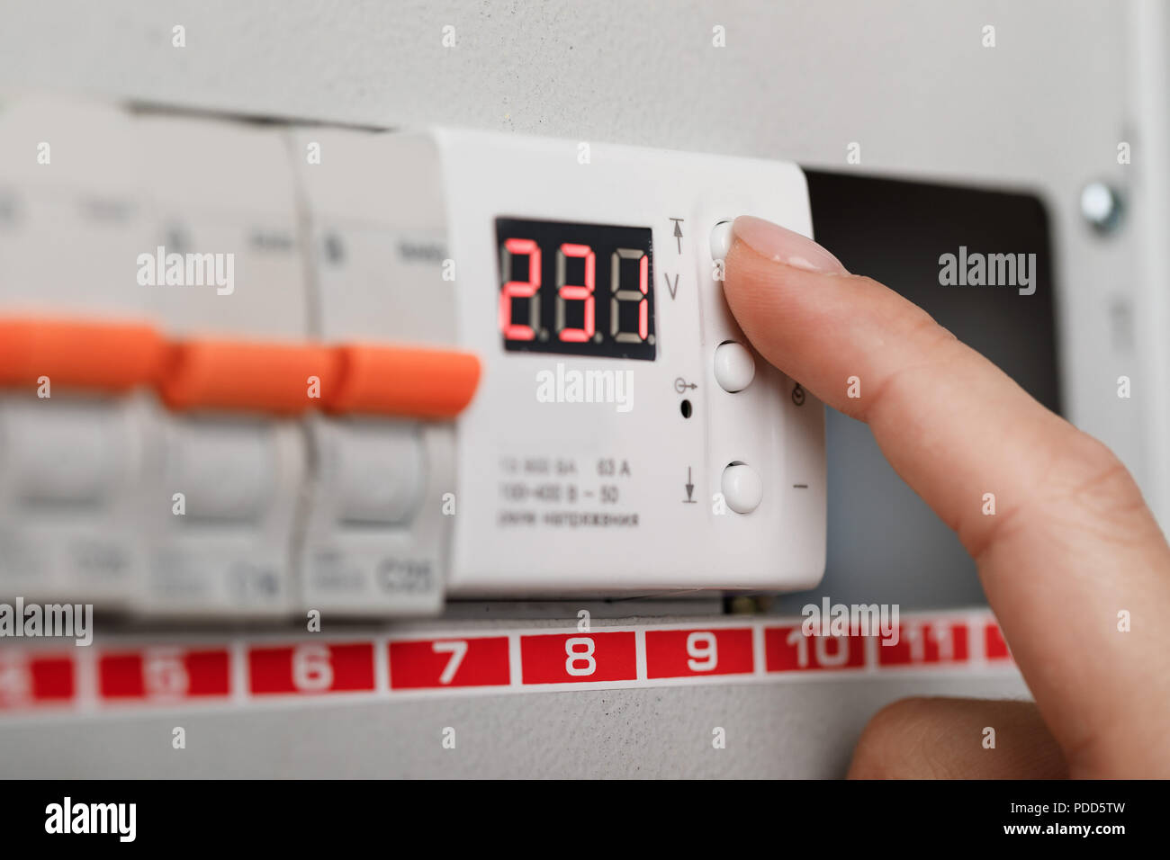 Electrical terminal box. man turn on or off Stock Photo