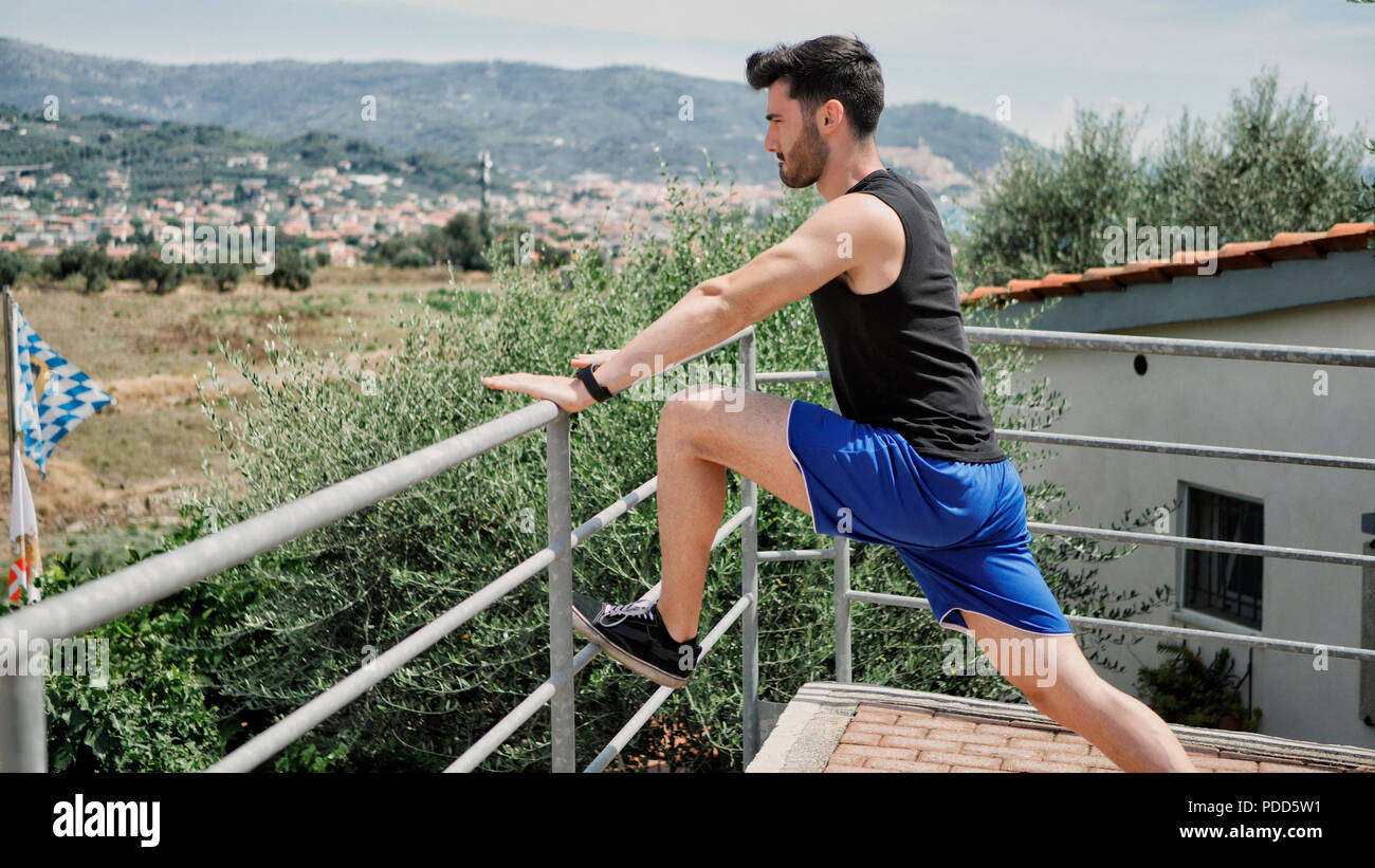 Active man doing stretching hi-res stock photography and images - Alamy