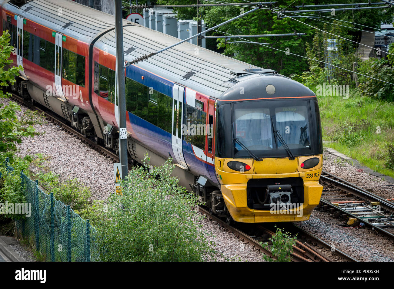 Class 333 passenger train in Northern livery travelling towards Ilkley in West Yorkshire. Stock Photo