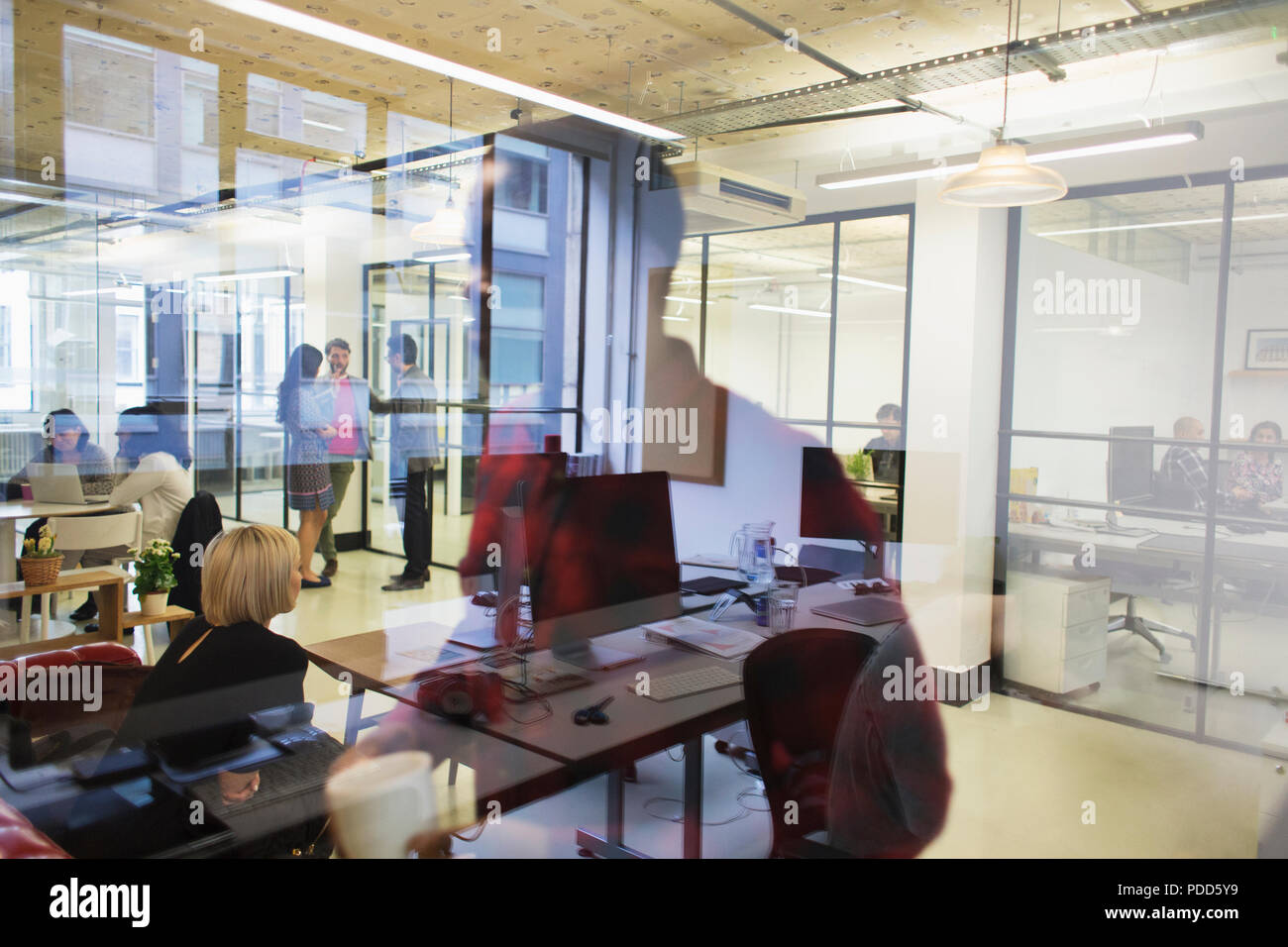 Business people in open plan office Stock Photo