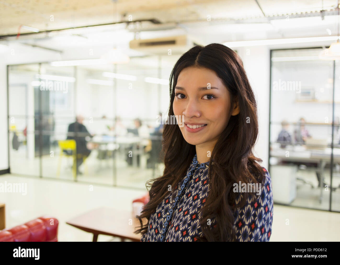 Portrait confident young businesswoman in office Stock Photo